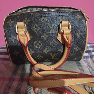 Brown Monogram Mini Bag with Tan and Red Trim Could Be Used A Crossbody